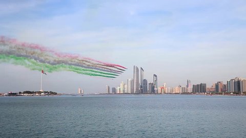 ABU DHABI, UAE - DECEMBER 02, 2018: Al Fursan aerobatic team doing stunts in the sky in Abu Dhabi as part of National day of UAE celebrations