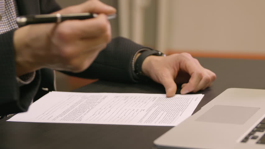 Businessman's Hand Filling Contract Form With Pen Royalty-Free Stock Footage #1020393820