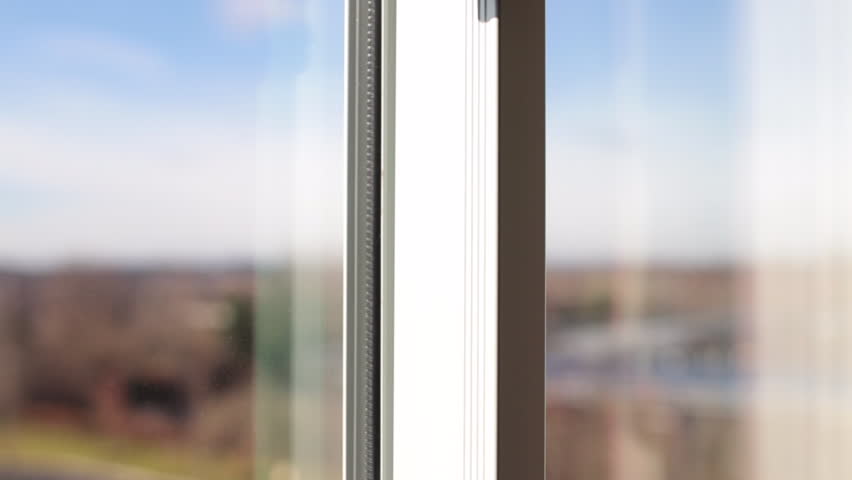 Tilt up to black bowtie haning in window