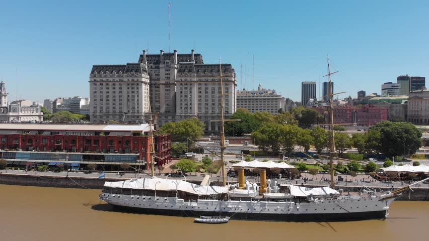 Aerial drone view of Puerto Madero harbor on rio de la plata river with city downtown skyscraper buildings in the background. Buenos Aires, Argentina.
