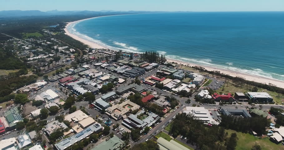 Aerial Wide Drone Shot of Byron Bay City, Australia. Surf Town, Beach Town, Buildings and Ocean. New South Wales
 Royalty-Free Stock Footage #1020408871