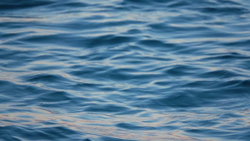 Close up of disturbed blue ocean water surface. Slow motion Royalty-Free Stock Footage #1020411034