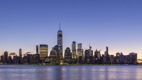Cityscape of Lower Manhattan, New York at Sunrise. United States of America. Night to Day Time Lapse