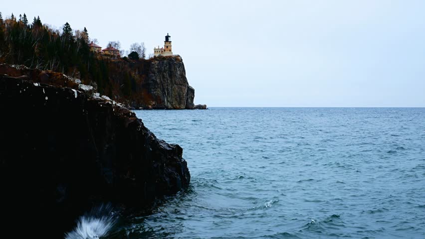 Waves break on shoreline at Split Rock Lighthouse on the north shore of Lake Superior near Duluth and Two Harbors, Minnesota.
