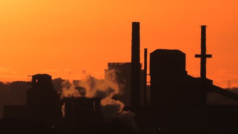 Global warming and climate change visual of heavy industry and smoke stacks
