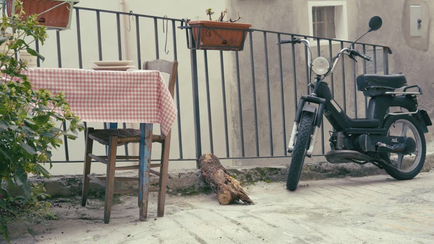A table, a vintage scooter