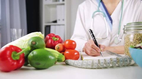 Vegetable diet nutrition and medication concept. Nutritionist offers healthy vegetables diet.