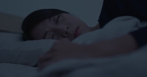 Woman sleep on bed at night