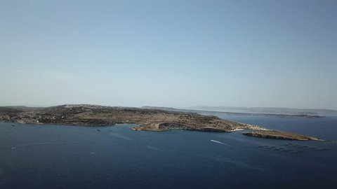 Aerial pan from sea to Buggiba city in Malta.