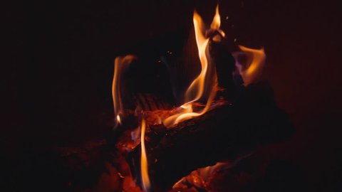 Close up panning of a burning fireplace. Slow motion.