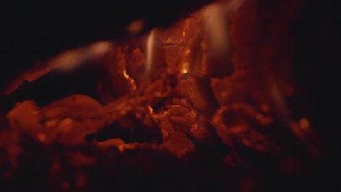 Close up of a burning fireplace. Macro details. Slow motion.