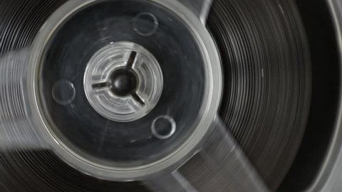 Rotation reel with tape, audio tape recorder