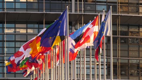 STRASBOURG, FRANCE - CIRCA 2018: Pan over all flags of European Union member states on a warm sunny day in front of European parliament