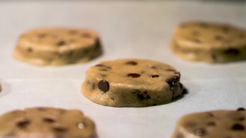 Chocolate chip cookies time lapse baking in the oven with camera pan.