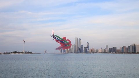 ABU DHABI, UAE - DECEMBER 02, 2018: Al Fursan aerobatic team doing stunts in the sky in Abu Dhabi as part of National day of UAE celebrations