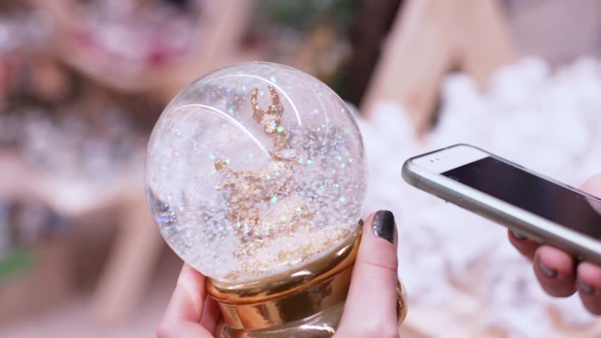 close-up shot of woman hands in the market chooses christmas decorations and balls for celebrate christmas and new year