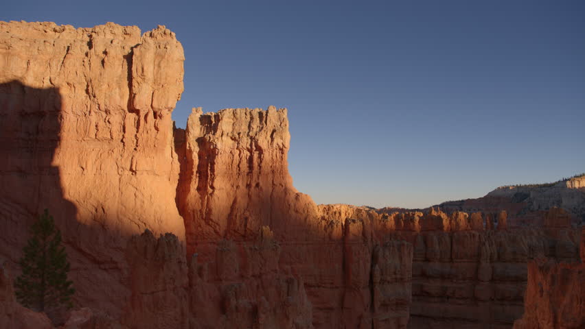 Bryce Canyon as seen looking up from below the rim at sunset. Nice light and shadows on the canyon walls.