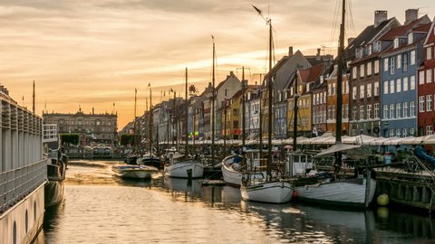 Summer sunset on Nyhavn canal, one of the most iconic places of Copenhagen, Denmark. Time lapse video.