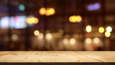 wood table top counter with abstract blur people moving in restaurant at dinner for present product on table frame