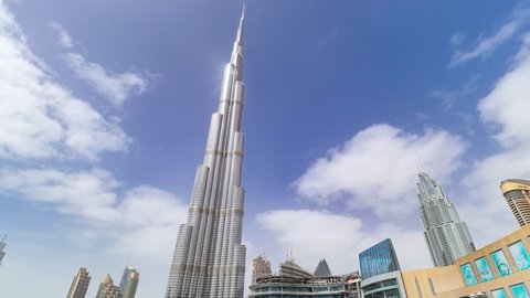 Dubai, United Arab Emirates - November 11, 2018: Timelapse hyperlapse of Burj Khalifa skyscraper tower. The tallest building in the world. Filmed during the day with fountain in front. UAE
