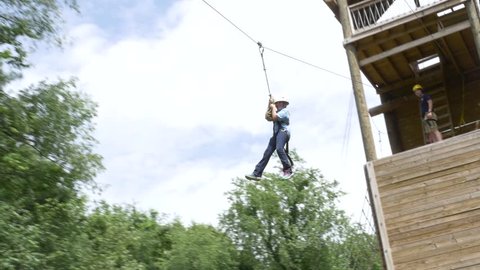 St, Louis, OH / United States - 06 10 2016: Kids on ropes and zipline at 4H Camp in Ohio