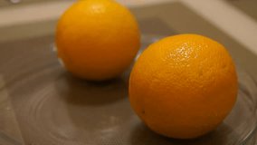 Peeling Orange. Hands peeling fruit. Fresh orange. Healthy food