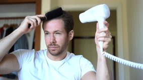 Young Man Blow Drying Hair In Morning Grooming Routine, 4K.