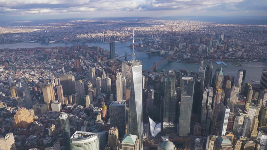 One World Trade Center in Sunny Day. Lower Manhattan Skyline. Aerial View. Camera Tilts Down. New York City. United States of America