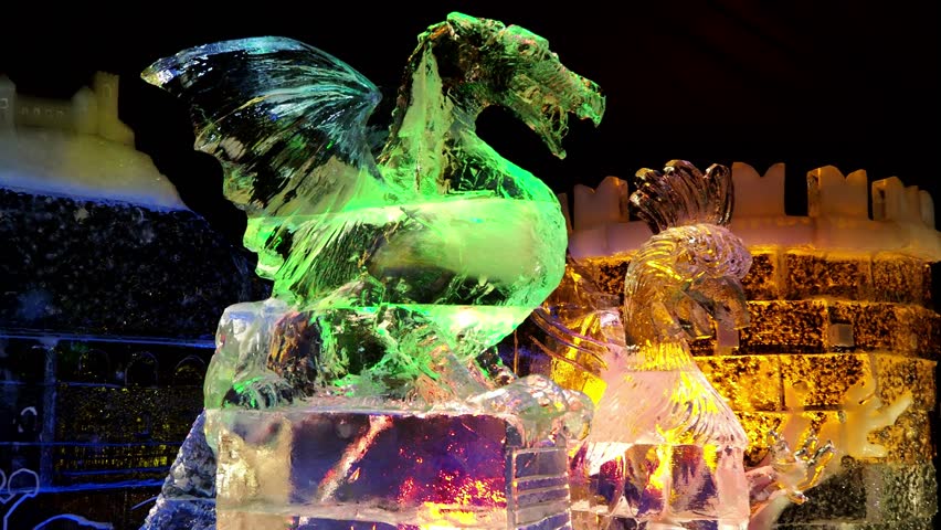 Ice sculpture of a dragon, rooster and Ljubljana castle.  Royalty-Free Stock Footage #1020523633