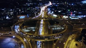 Aerial drone hyperlapse - timelapse high speed night video of urban elevated toll ring road junction and interchange overpass