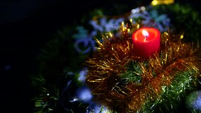 Footage of candle burning, balls and star Christmas. Merry Christmas