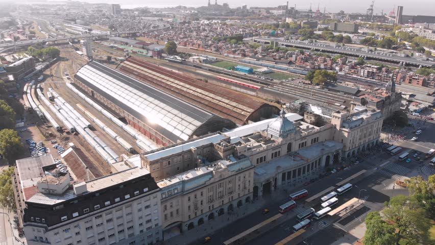 Aerial drone view of the old historic Retiro Estacion train station in Buenos Aires, Argentina. Located in Plaza Fuerza Aerea Argentina next to Avenida del Libertador. Train and rail.