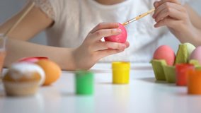 Child painting color eggs brush, decorating Easter symbol, preparation festival - Powered by Shutterstock - Get 15% off with code: PIKWIZARD15