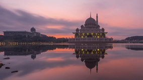 Sunrise Time Lapse at Putra Mosque and Prime Minister Office by a lake in Putrajaya, Malaysia. Prores 1080p. Zoom Out Motion Timelapse.