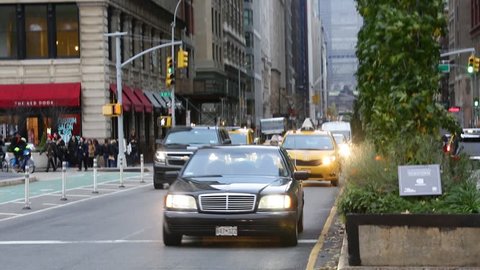 New York, NY / USA - 11 20 2018: Manhattan road traffic, yellow taxi, traffic jam. 