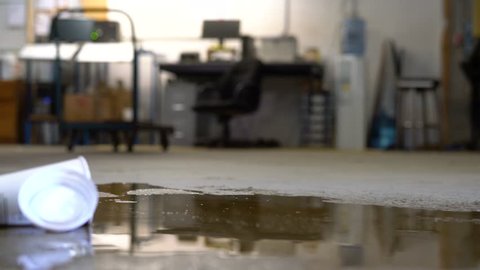 A worker slips on a puddle in a distribution warehouse. A safety training topic.