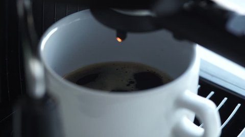 coffe dispenser with cup of coffee