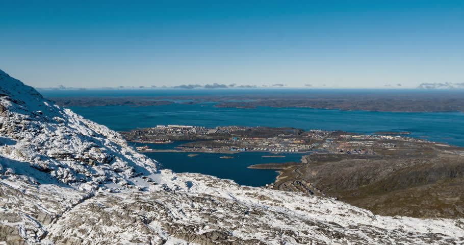 Greenlands capital Nuuk - largest city in Greenland aerial view. Drone video of Nuuk from air, aka Godthaab seen from Mountain Sermitsiaq also showing Nuup Kangerlua fjord.