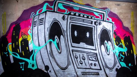 timelapse of a graffiti artist spraying a boom box ghettoblaster on a wall. the creation of the artwork grows step by step without seeing the artist