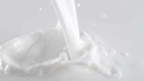 Super slow motion of pouring milk, filmed on high speed cinema camera, 1000 fps.
