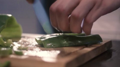 Italian Chef cut and chop green pepper.