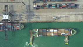 Video Container ship in export and import business and logistics. Shipping cargo to harbor by crane. Water transport International. Aerial view and top view.