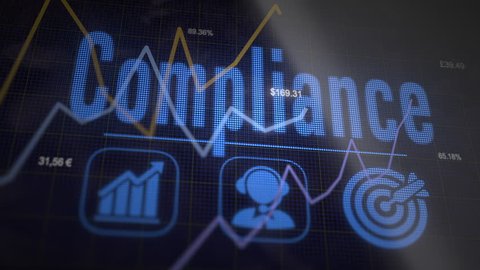 Compliance business concept on a flashing computer monitor with moving graphs and data.