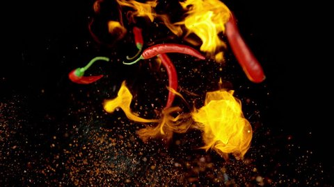Chili Peppers and Spices in Flames Flying up and Falling down in Slow Motion. Shot with High Speed Camera, Phantom Flex 4K.