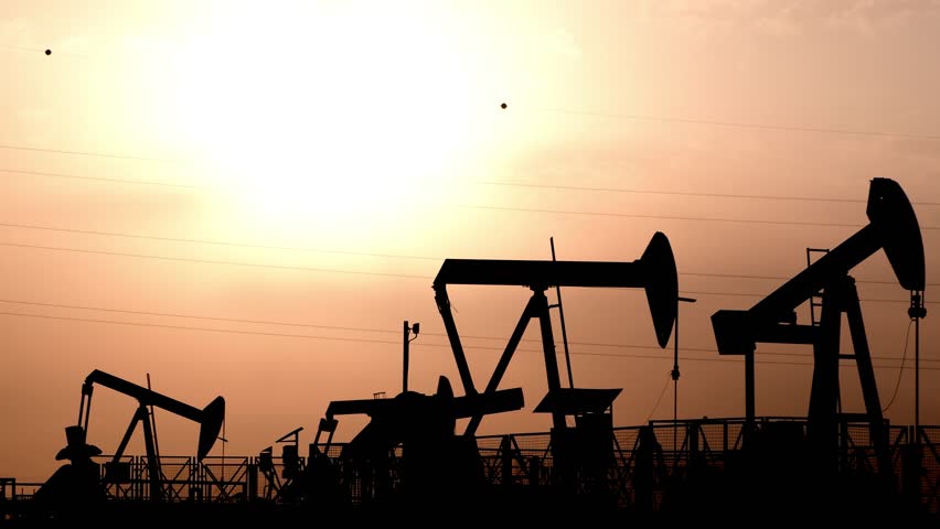 Silhouette of crude oil pump in the oilfield at cloudy sunset Royalty-Free Stock Footage #1020623374