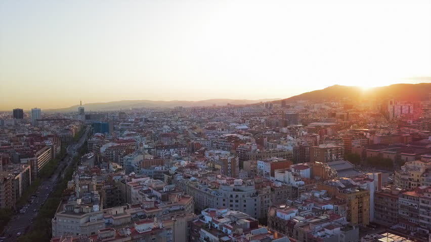 Aerial Lockdown: Sun Behind Mountain Of Barcelona