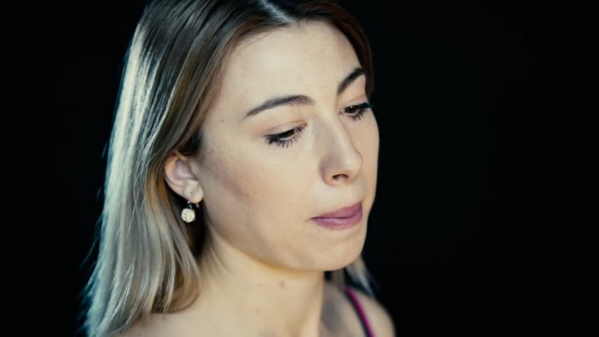 A girl’s headache, a woman has headache in different life circumstances, she clearly shows that she is in pain, clutches her head, a woman’s migraine, takes migraine pills, works on camera