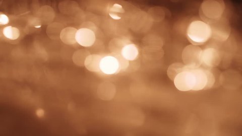Golden lights, glowing abstract background. 4K resolution