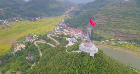 Lung Cu flag tower. Royalty high-quality stock video footage of Lung Cu flagpole in Ha Giang province, Vietnam. LungCu is the northernmost point in the country and you can see the border with China