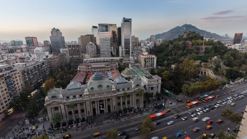 Day to night sunset timelapse hyperlapse of the historic national library of Santiago Chile in city downtown near Santa Lucia. Biblioteca Nacional de Chile. Skyscraper building in background. Royalty-Free Stock Footage #1020640744